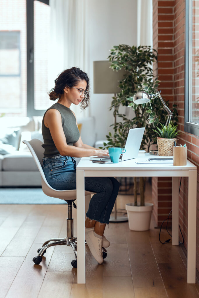 Women typing at computer