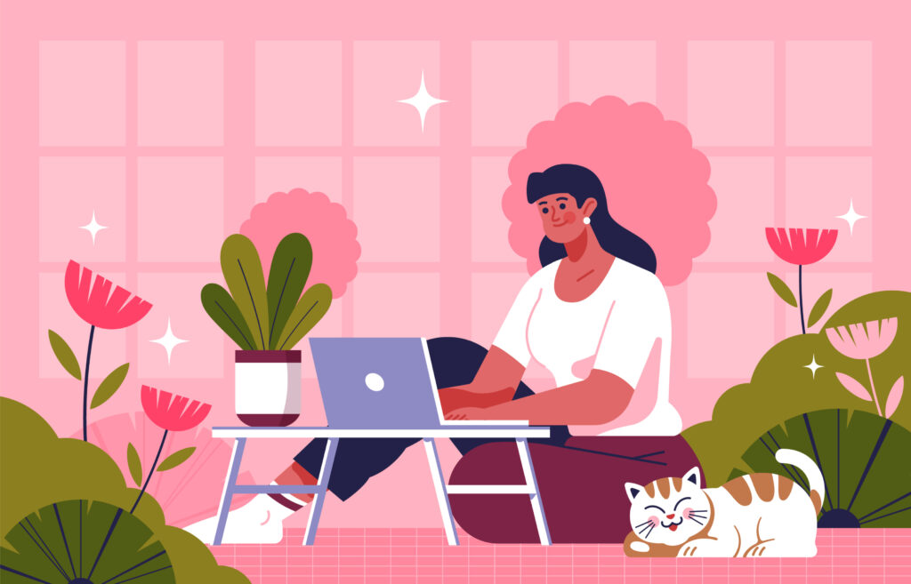 Woman typing at a computer next to a cat