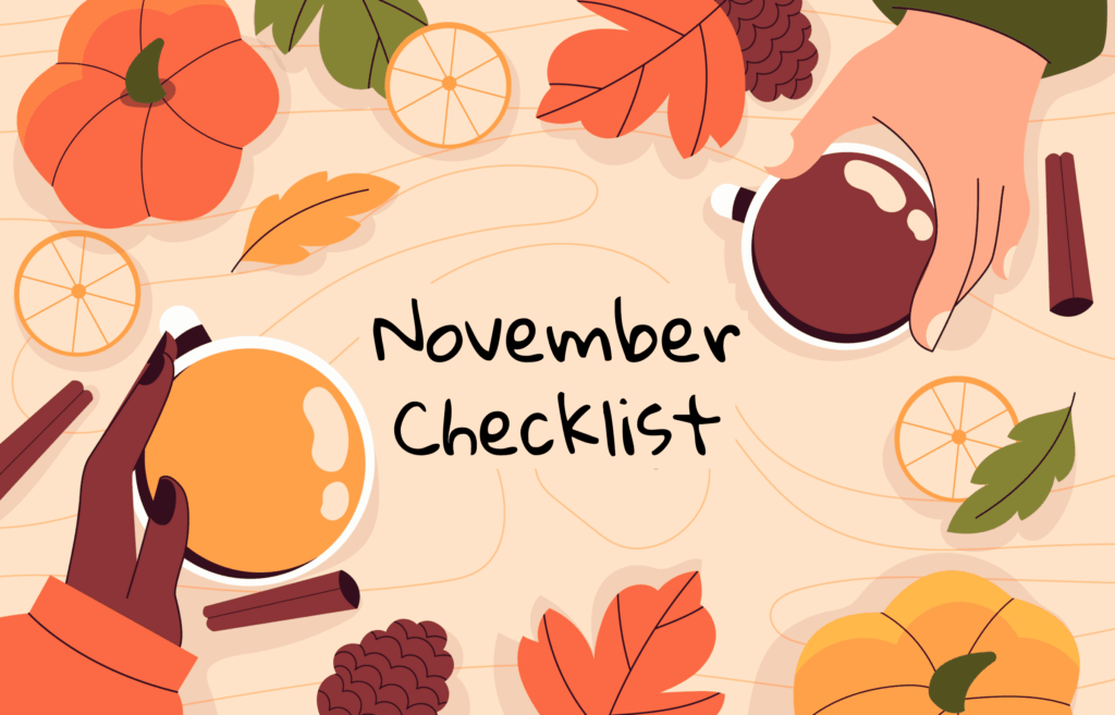 Tabletop view of hands with mugs, pumpkins, and fall leaves