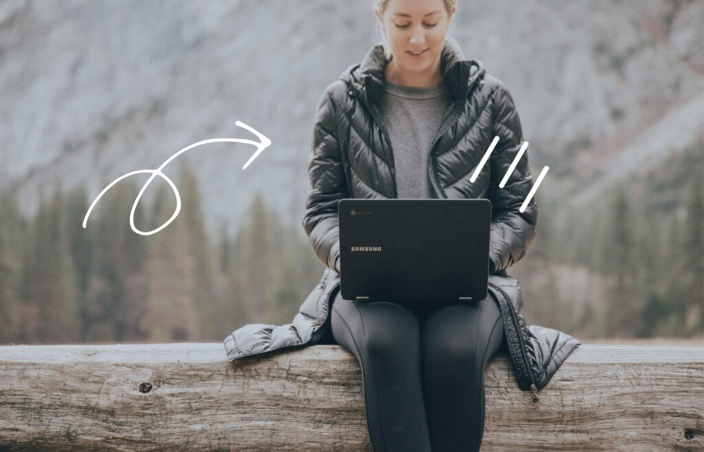 Woman using a laptop outdoors